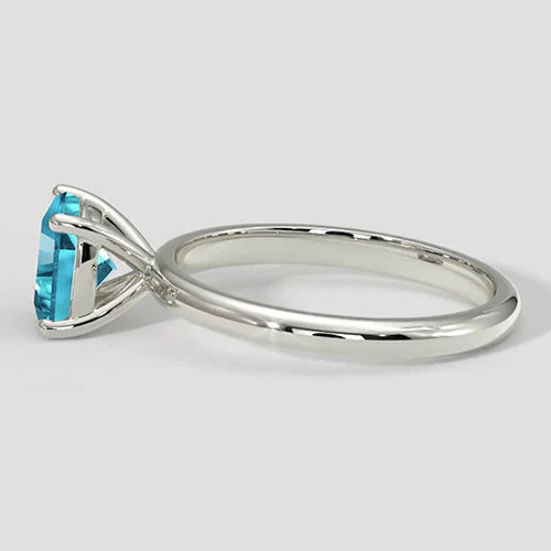 Anello taglio cuscino Paraiba bluastro naturale
