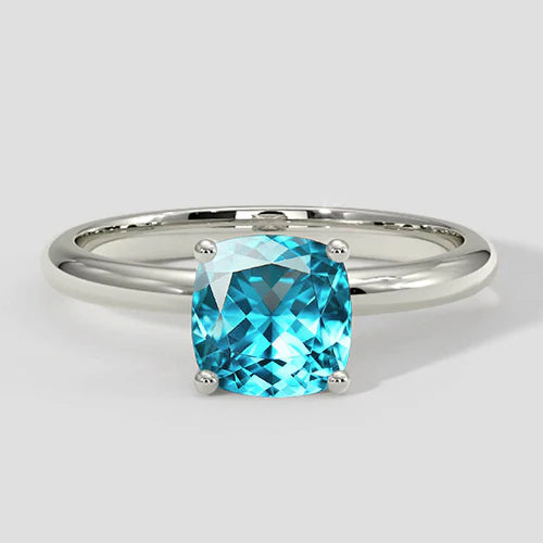 Anello taglio cuscino Paraiba bluastro naturale