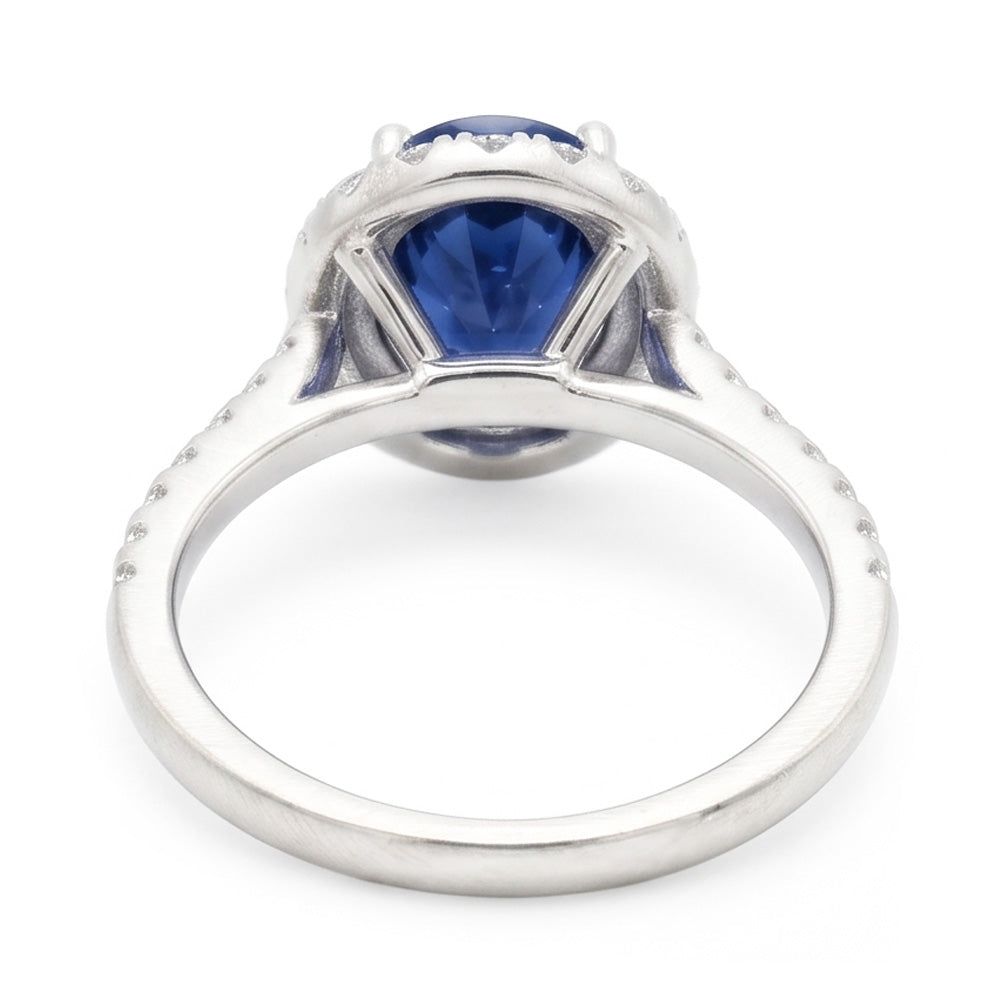 Fede nuziale ovale con zaffiro blu e diamanti da 2.25 carati. oro bianco 14K