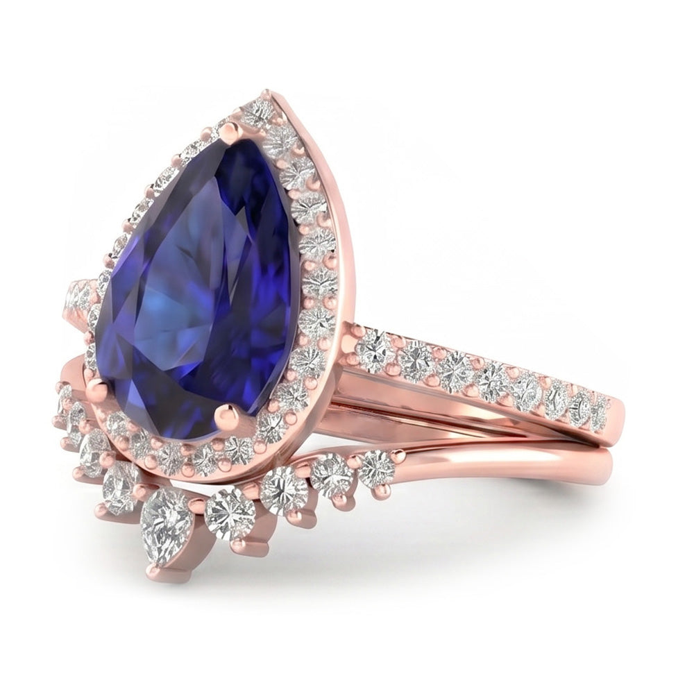 Fedi nuziali a forma di pera con zaffiro blu intenso e diamanti 4.50 carati