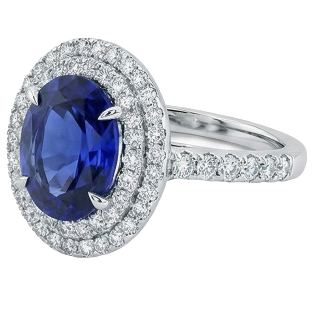 Grande anello ovale con zaffiro blu dello Sri Lanka e diamante. oro bianco da 4.55 ct. 14K