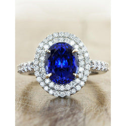 Grande anello ovale con zaffiro blu dello Sri Lanka e diamante. oro bianco da 4.55 ct. 14K