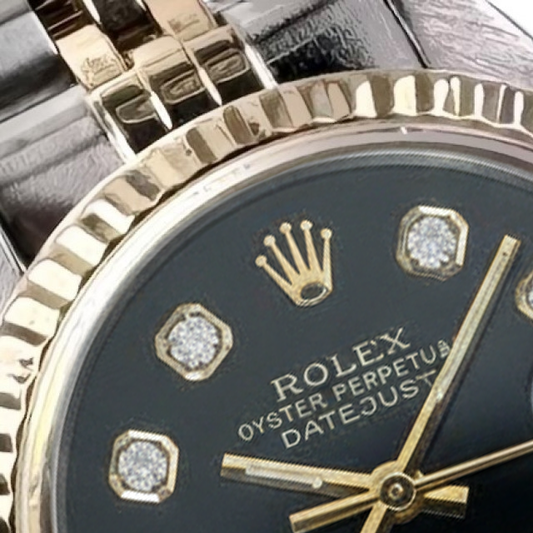 Lunetta scanalata Rolex in acciaio inossidabile e oro con quadrante con diamanti baguette Datejust Orologio