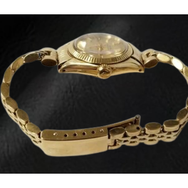 Orologio Rolex Oyster Perpetual da 24 mm con quadrante champagne e oro giallo