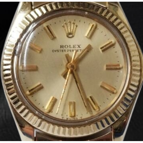 Orologio Rolex Oyster Perpetual da 24 mm con quadrante champagne e oro giallo