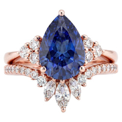 Set di fedi nuziali con zaffiro blu marquise da 4 carati e diamanti tondi