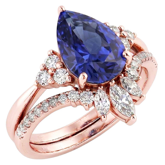 Set di fedi nuziali con zaffiro blu marquise da 4 carati e diamanti tondi