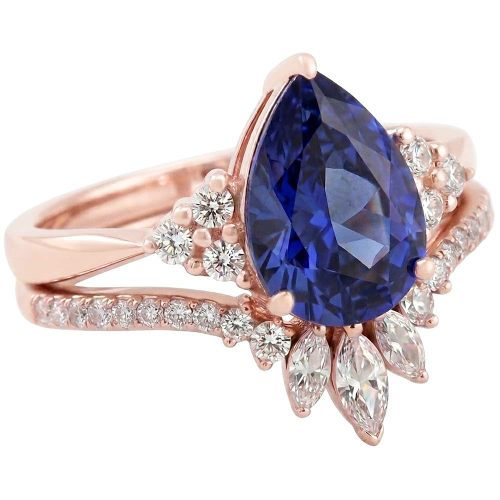Set di fedi nuziali con zaffiro blu marquise da 4 carati e diamanti tondi