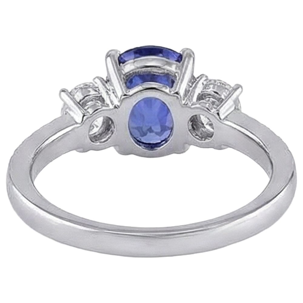 Taglio ovale 4.50 ct. Anello in stile tanzanite con diamanti 3 pietre 14K