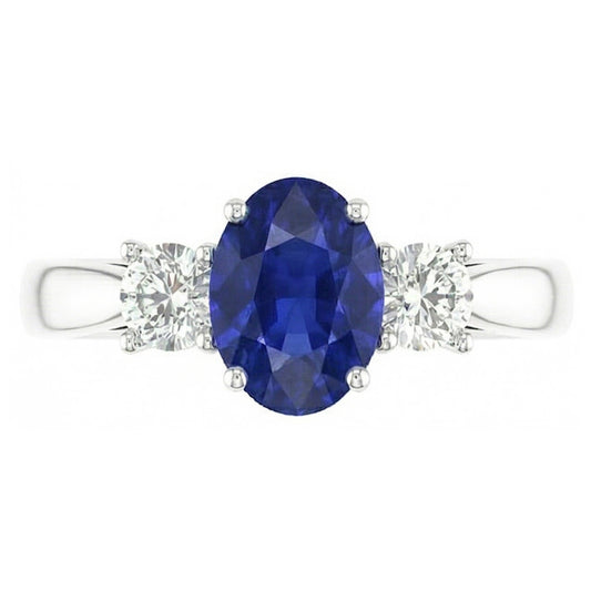 Zaffiro ovale. tre pietre rotonde. anello di diamanti. 2 carati. oro 14K