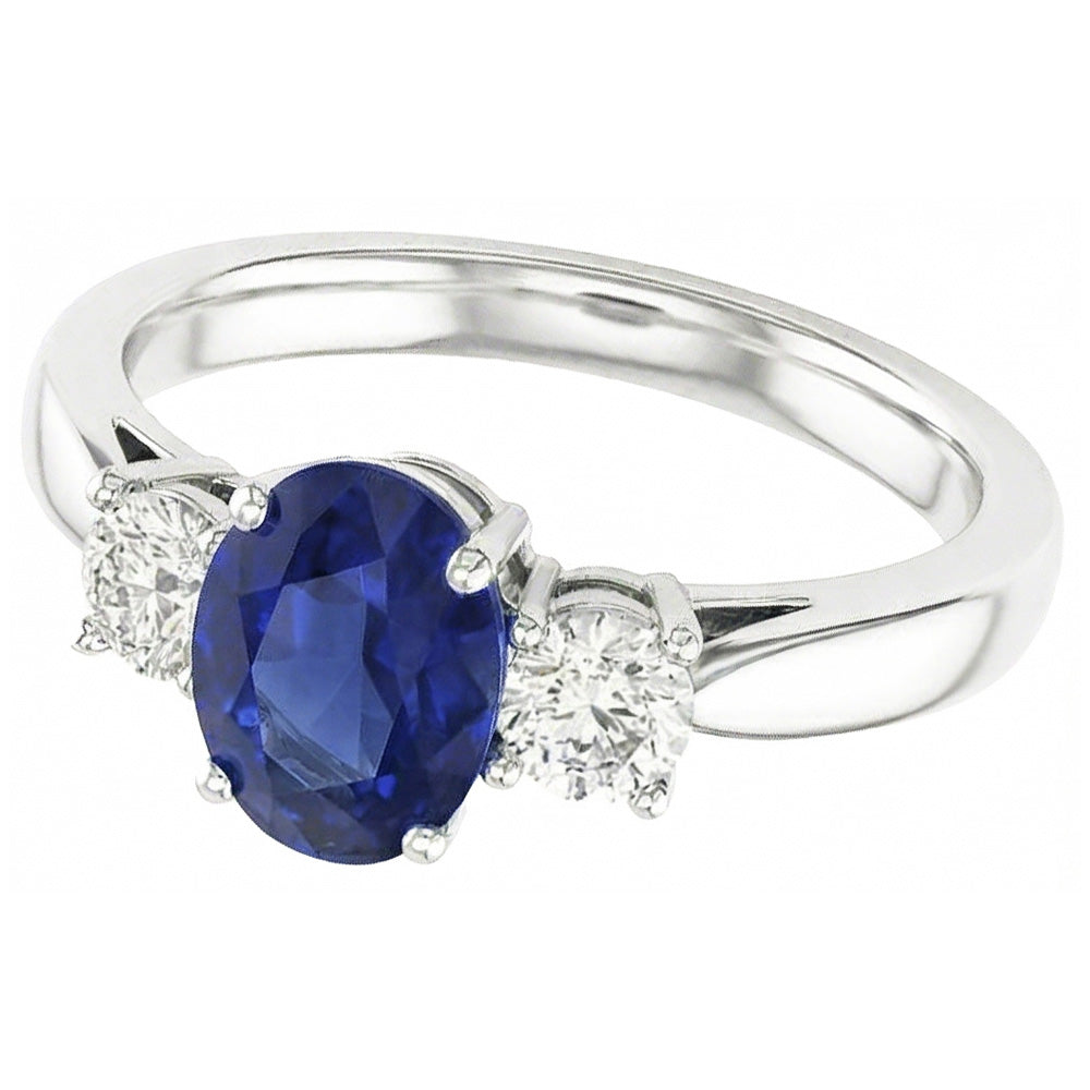 Zaffiro ovale. tre pietre rotonde. anello di diamanti. 2 carati. oro 14K