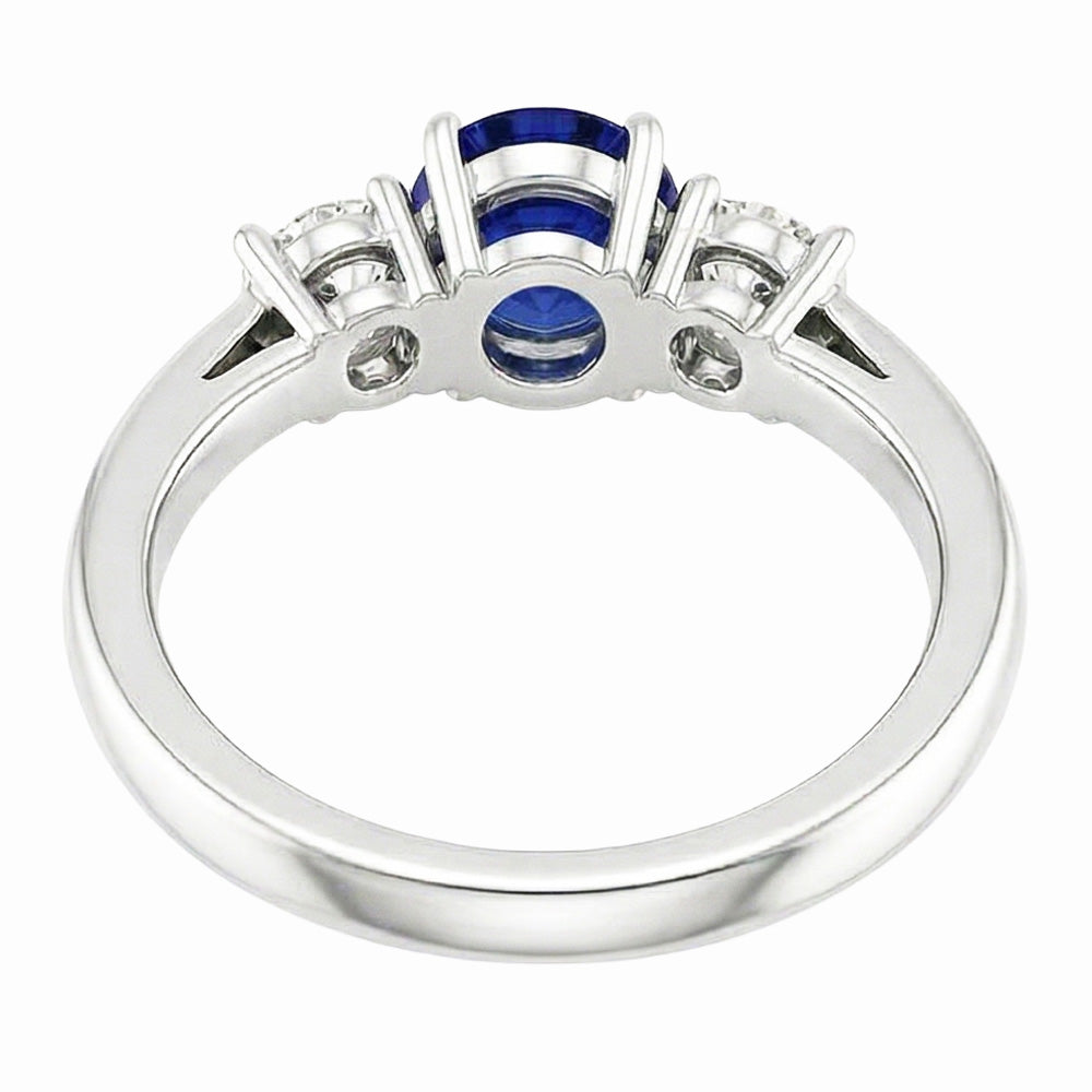 Zaffiro ovale. tre pietre rotonde. anello di diamanti. 2 carati. oro 14K