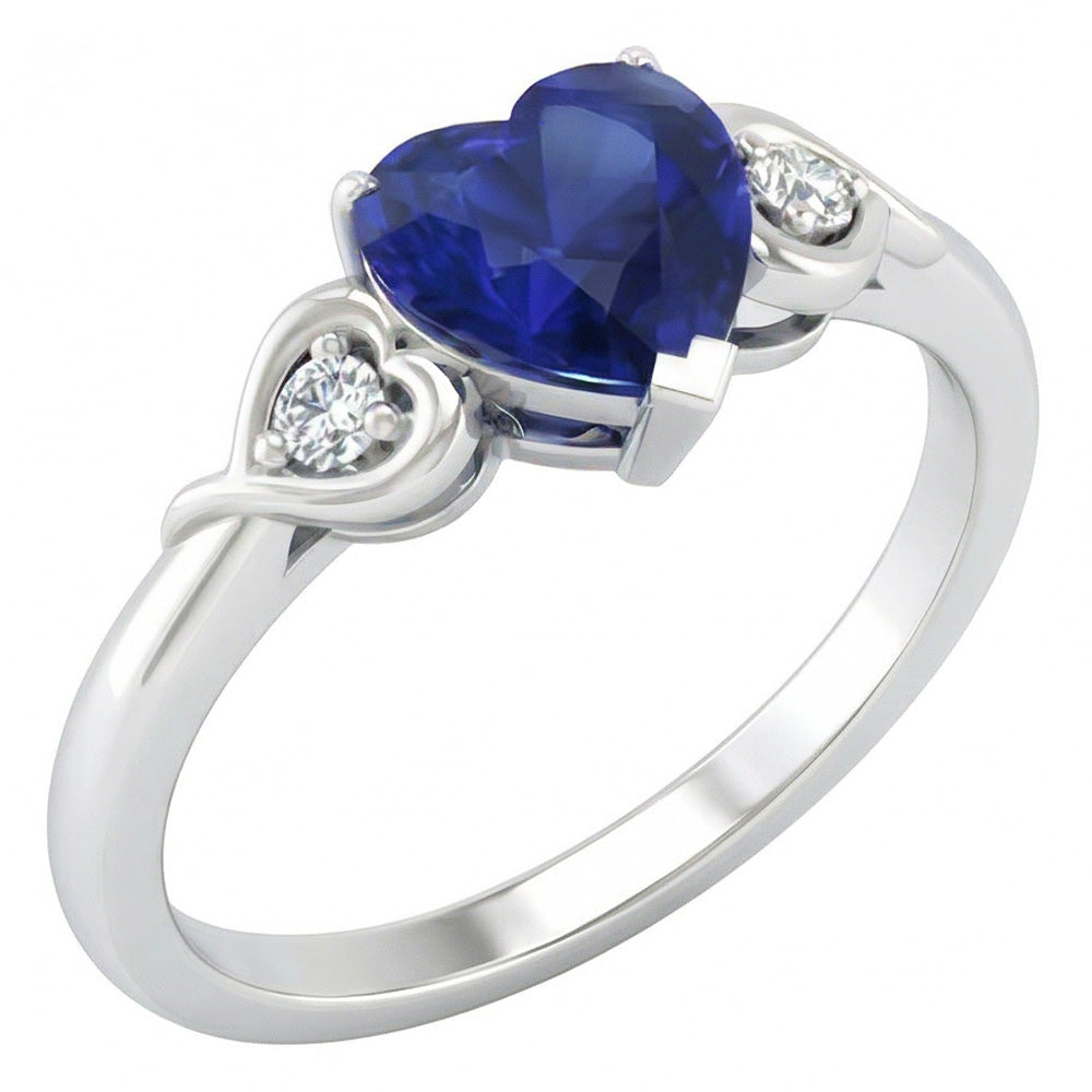 anello cuore con zaffiro blu profondo 1,75 carati e diamanti tre pietre in oro bianco 14K
