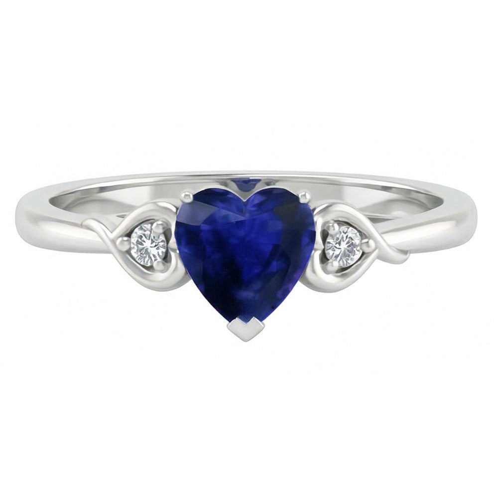 anello cuore con zaffiro blu profondo 1,75 carati e diamanti tre pietre in oro bianco 14K