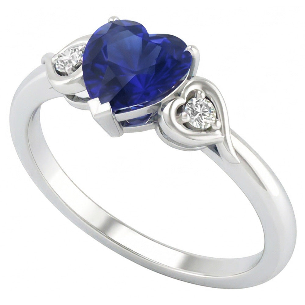 anello cuore con zaffiro blu profondo 1,75 carati e diamanti tre pietre in oro bianco 14K