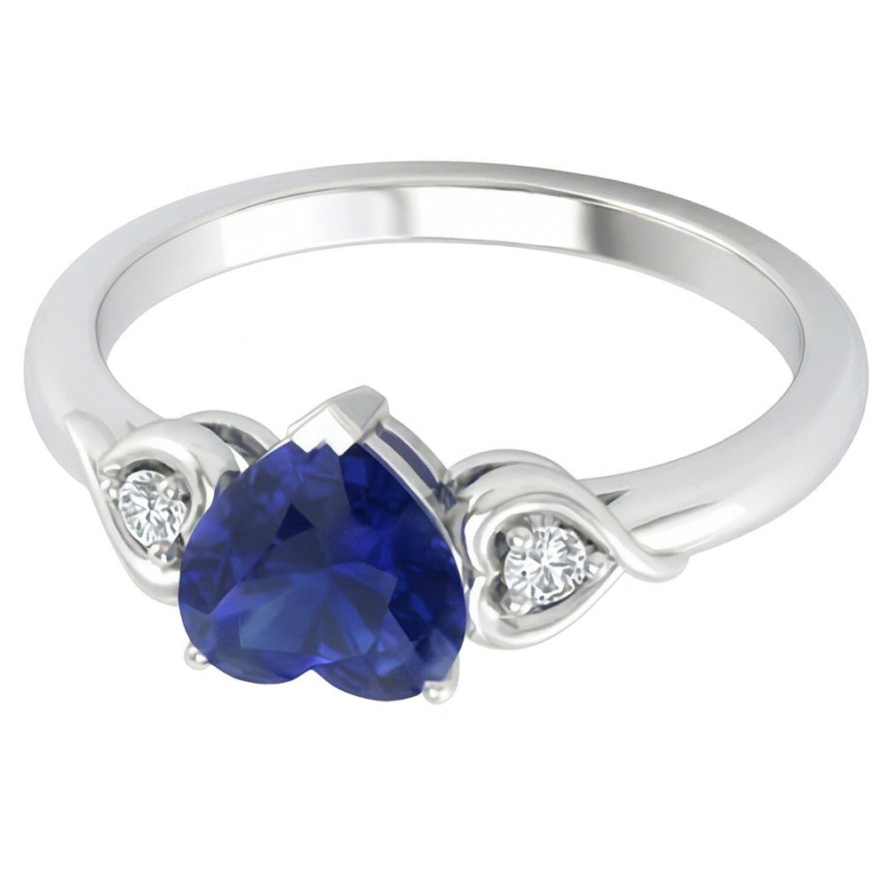 anello cuore con zaffiro blu profondo 1,75 carati e diamanti tre pietre in oro bianco 14K