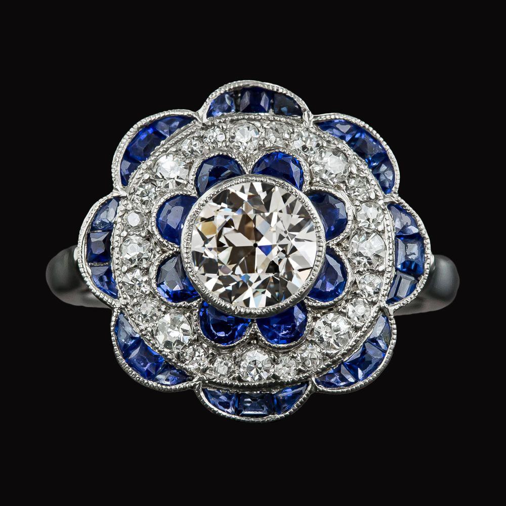 Anello Halo con diamanti a taglio antico e zaffiri blu stile fiore 4.50 carati - harrychadent.it