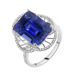 Anello Halo con zaffiro blu smeraldo e diamanti rotondi 4 carati