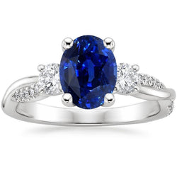 Anello a tre pietre con zaffiro blu ovale e accenti di diamanti rotondi 4 carati