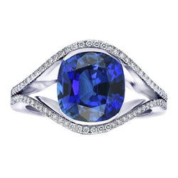 Anello con diamanti ovale con zaffiro di Ceylon. gambo diviso. 4.50 carati