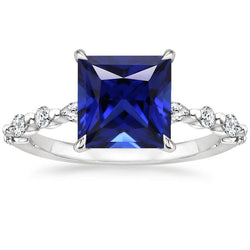 Anello con diamanti rotondi e pera con zaffiro blu taglio principessa 5.25 carati