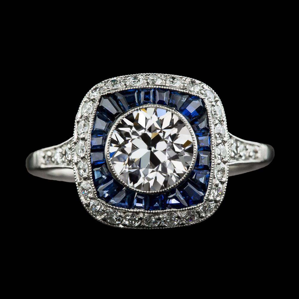 Anello con doppio alone di diamanti di taglio antico e zaffiri trapezoidali 4.50 carati - harrychadent.it