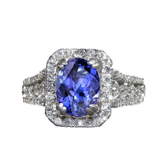 Anello con tanzanite ovale e pavé di diamanti 5.70 carati WG 14K - harrychadent.it
