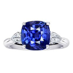Anello con tre pietre di pera. diamante e cuscino. zaffiro blu 3.50 carati