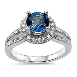 Anello con zaffiro Ceylon 5 carati e diamanti taglio rotondo in oro bianco 14K