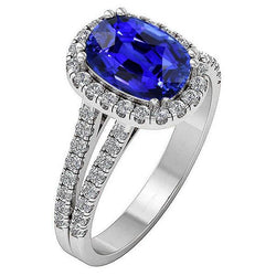 Anello con zaffiro blu a forma ovale con diamante a gambo diviso 5 carati