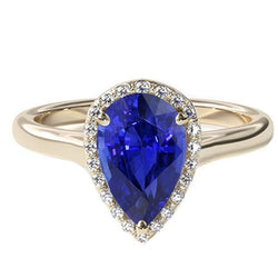 Anello di fidanzamento con alone blu zaffiro taglio pera e diamanti 4 carati