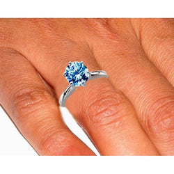 Anello di fidanzamento con diamante blu 2 ct e pietre preziose in oro bianco
