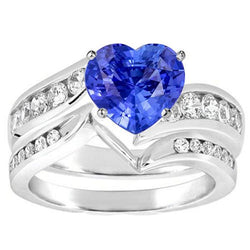 Anello di fidanzamento in oro bianco con diamante e zaffiro blu. set 4 carati