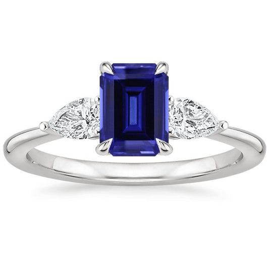 Anello in oro 3 pietre con zaffiro blu taglio smeraldo e diamante a pera 3.50 carati - harrychadent.it