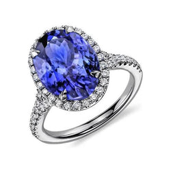 Anello in oro bianco 14 carati con tanzanite da 6.85 ct con aureola e diamanti