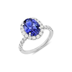 Anello in oro bianco 14 carati con tanzanite ovale da 11.25 carati con diamanti rotondi