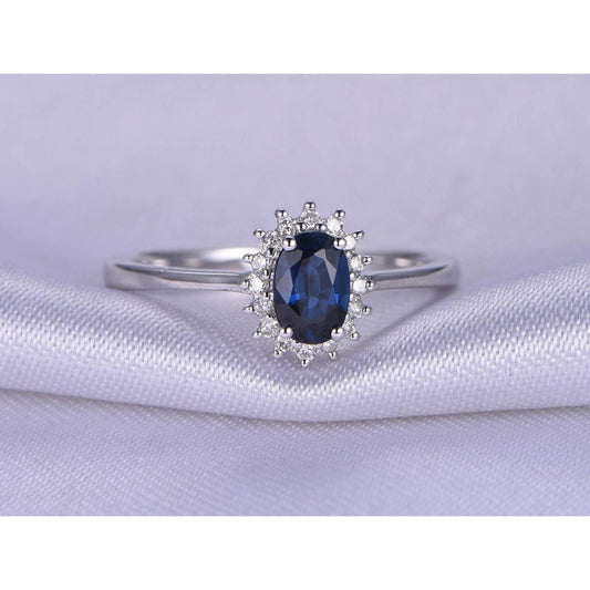 Anello in oro bianco 14 carati con zaffiro blu taglio ovale 2.5 carati e diamanti - harrychadent.it