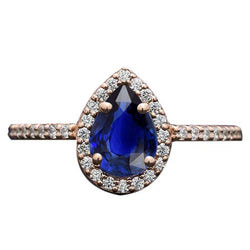 Anello in oro rosa con alone blu zaffiro taglio a pera e diamante accentato 3 carati