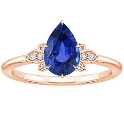 Anello in pietra preziosa zaffiro blu pera e diamante rotondo stile floreale 3 carati