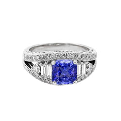 Anello in zaffiro con diamante rotondo. occhiello aperto. gambo diviso. 2.50 carati