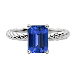 Anello solitario smeraldo con zaffiro blu stile corda intrecciata in oro 2 carati