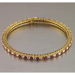 Bracciale tennis con rubini e diamanti 12.54 carati in oro giallo Novità