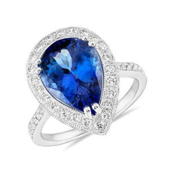 Fedi nuziali con tanzanite a pera e diamanti. gioielli in oro 2.25 carati
