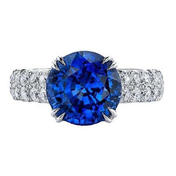 Grande anello rotondo con diamante. autentico zaffiro blu. 6 carati. con griffe in oro