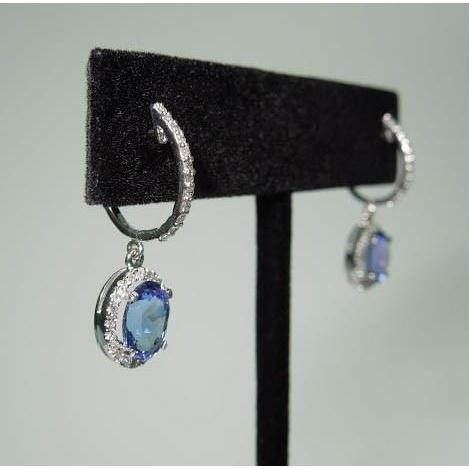 Orecchini circolari pendenti con tanzanite ovale da 3.64 carati e diamanti rotondi - harrychadent.it