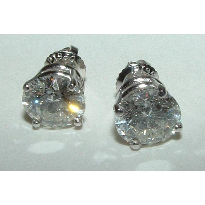 Orecchini in platino con diamanti rotondi F Vs1 da 4 carati - harrychadent.it