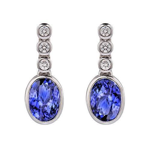 Orecchini pendenti in oro bianco con tanzanite e diamanti incastonati a castone da 5.60 ct - harrychadent.it