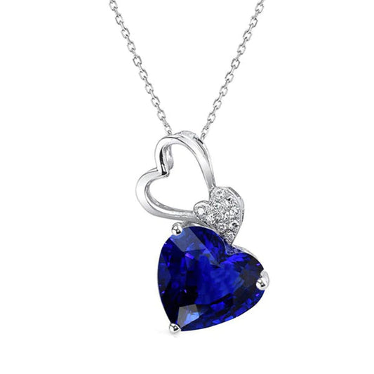 Pendente in oro bianco 14K con zaffiro blu scuro a cuore e diamanti 2,50 carati - harrychadent.it