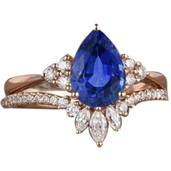Set di fedi nuziali con zaffiro blu marquise da 4 carati e diamanti tondi